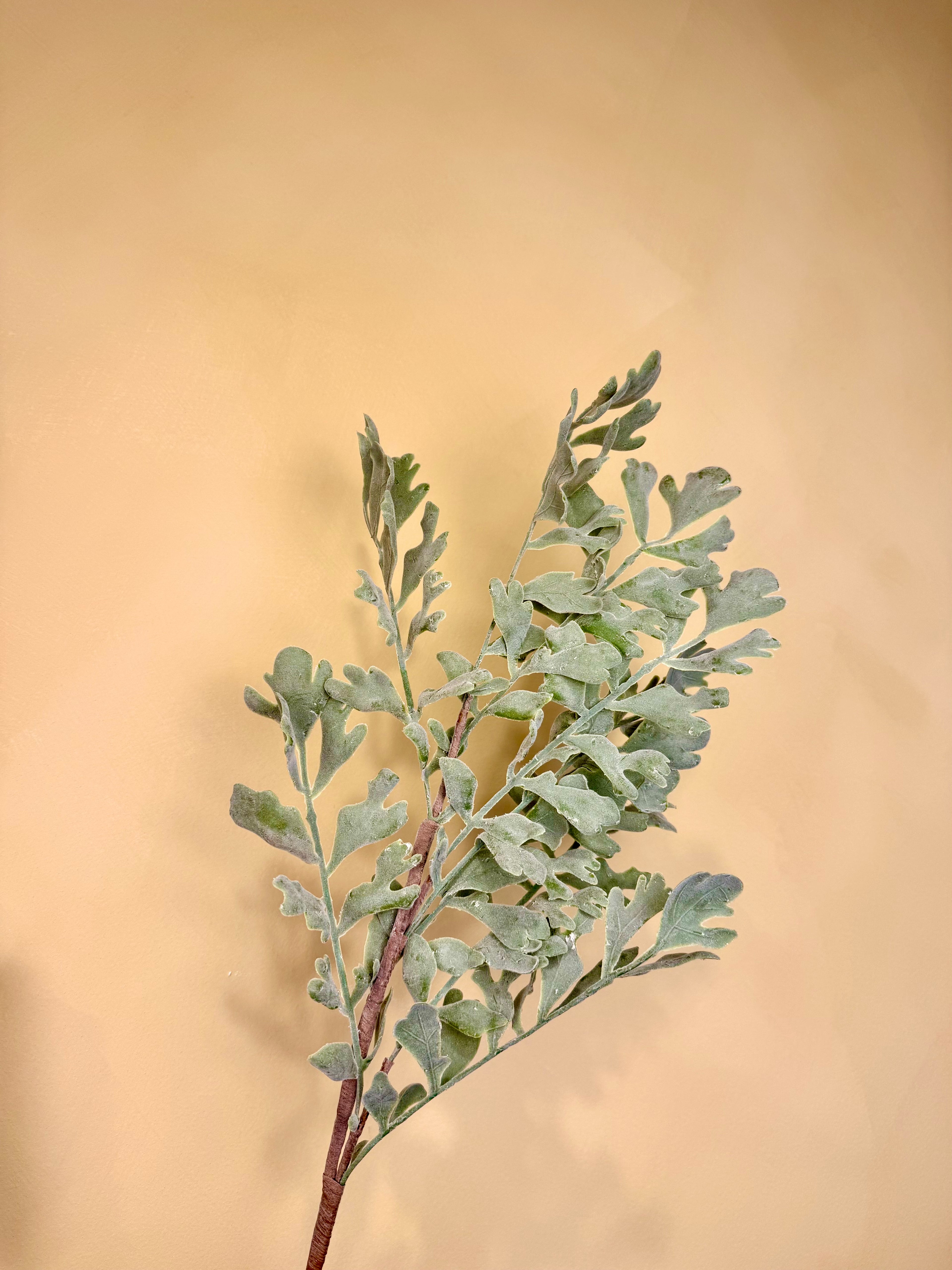 Frosted Leaf Stem: 28" Snow-Dusted Winter Greenery